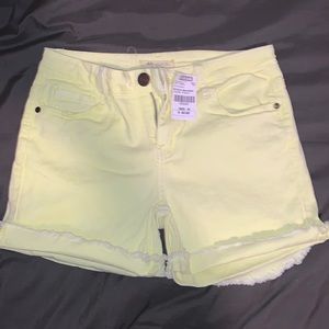 Neon yellow raw hem denim shorts